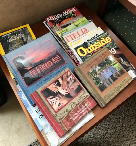 Magazines and photo albums on table